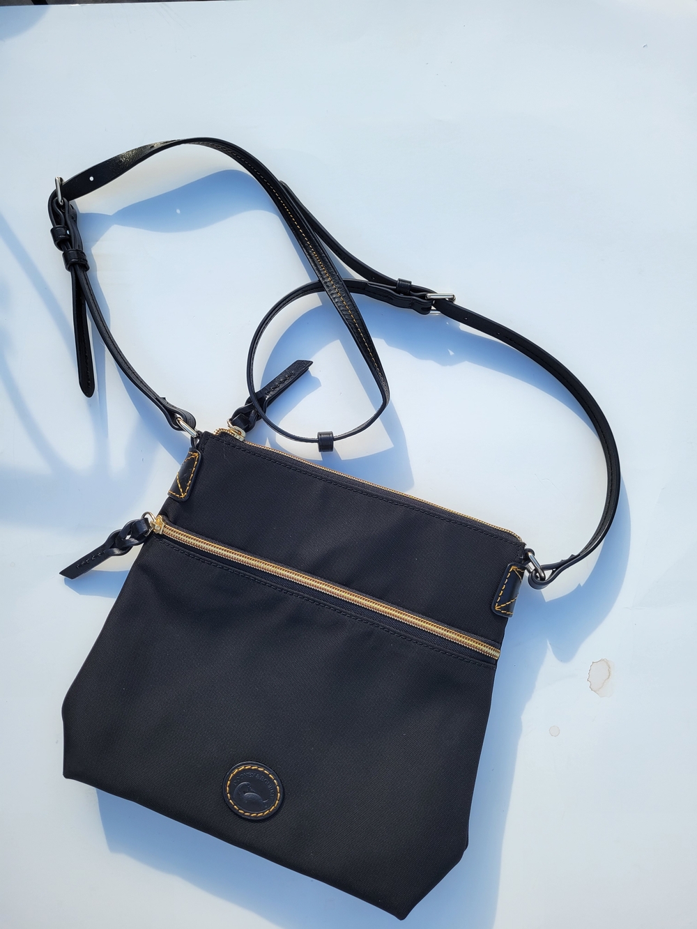LIKE NEW Condition Dooney & Bourke Black Crossbody, Adjustable Strap, Red Lined